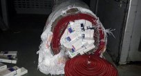 HALI İÇERSİNE ZULALANMIŞ 3 BİN 500 PAKET KAÇAK SİGARA