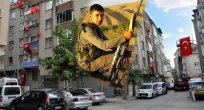 ŞEHİT EVİ BAYRAKLARA DONATILDI